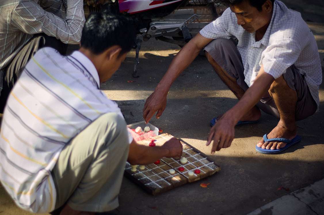 Men playing a board game